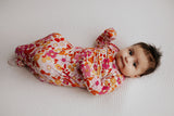 The cutest pink floral design for a newborn knotted baby gown. Trust in our knotted baby gowns, providing unparalleled comfort and ease for your baby's delicate skin.