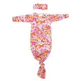 The cutest pink floral design for a newborn knotted baby gown. Trust in our knotted baby gowns, providing unparalleled comfort and ease for your baby's delicate skin.