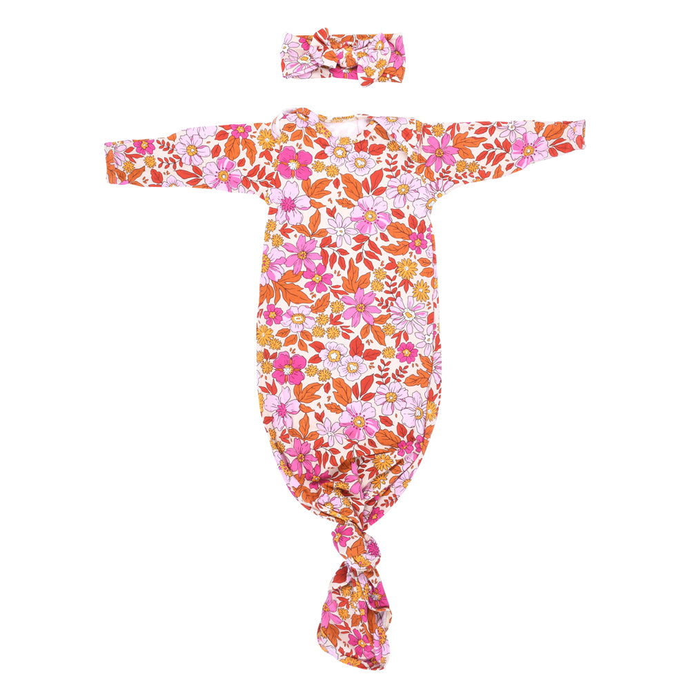 The cutest pink floral design for a newborn knotted baby gown. Trust in our knotted baby gowns, providing unparalleled comfort and ease for your baby's delicate skin.