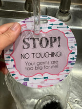 A Three Little Tots no touching my baby car seat sign is waterproof