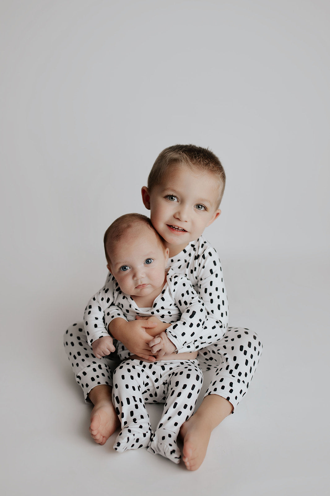 Ultra-soft polka dot baby gowns with stretchy fabric for ultimate comfort and easy night-time diaper changes.