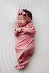 Luxuriously soft modal knotted baby gowns for newborn babies, offering comfort, easy diaper changes, and style. Three Little Tots Rose Pink Knotted baby gown 