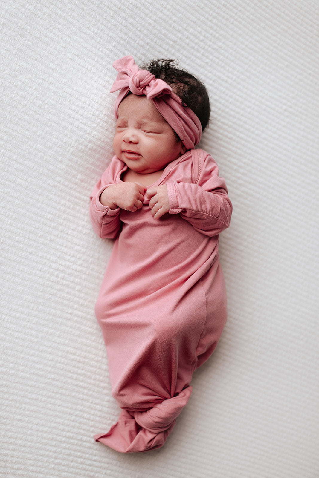 Luxuriously soft modal knotted baby gowns for newborn babies, offering comfort, easy diaper changes, and style. Three Little Tots Rose Pink Knotted baby gown 
