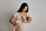 Mom nursing her baby in matching Three Little Tots labor and delivery gown and knotted baby gown
