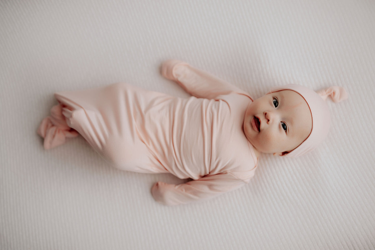 Such a cute photo of the perfect pink knotted gown by Three Little Tots