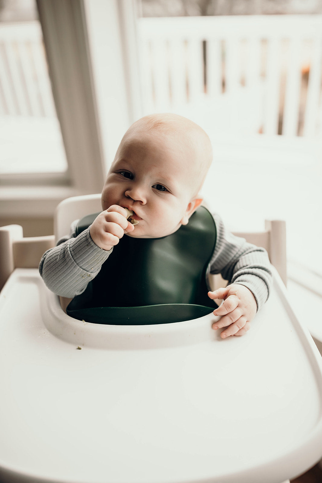 Designed in the USA, Three Little Tots food-grade silicone bibs with crumb catcher ensure comfort and cleanliness for your baby.