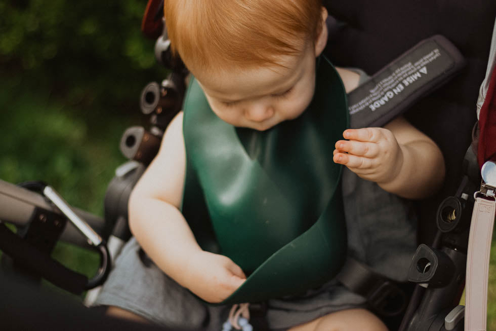 Designed in the USA, Three Little Tots food-grade silicone bibs with crumb catcher ensure comfort and cleanliness for your baby.