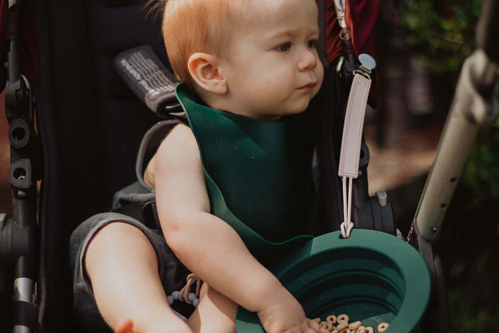 Designed in the USA, Three Little Tots food-grade silicone bibs with crumb catcher ensure comfort and cleanliness for your baby.