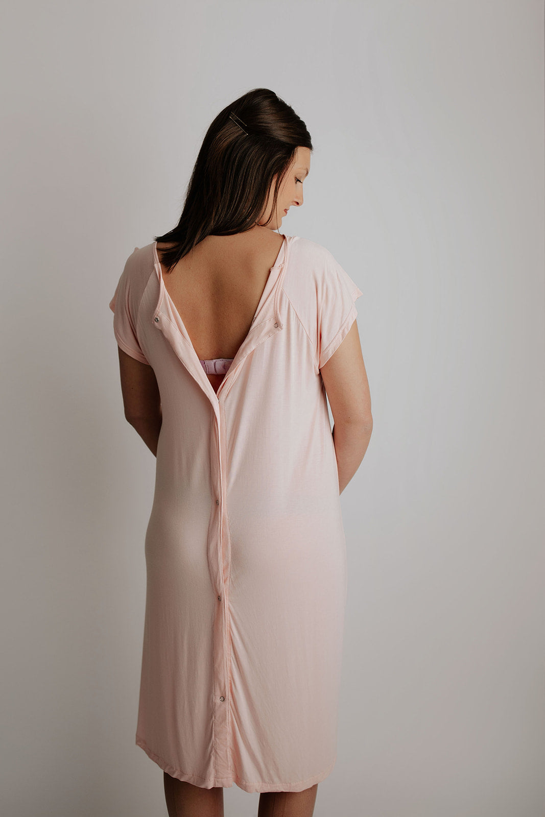 Snaps down the back of a Three Little Tots labor and delivery gown that allow the mom to be covered but allow for easy access for an epidural and monitors