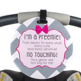 A sign for a newborn's car seat for premature babies that is a friendly reminder to look and not touch the baby
