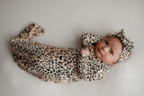 A newborn photoshoot idea with the Leopard Three Little Tots knotted baby gown with a cute bow.