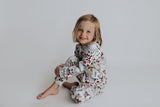 cute short hair haircut for girls. Wearing Three Little Tots Floral Pajams