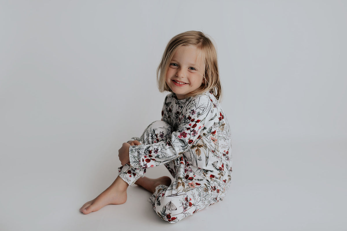 cute short hair haircut for girls. Wearing Three Little Tots Floral Pajams