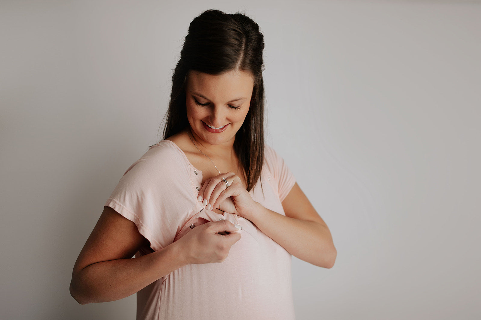 The Three Little Tots Labor and delivery gown features snaps down the shoulders that allow for the gown to be put on and taken off over IVs. It also gives instant skin on skin access after birth and comfy breastfeeding late at night.