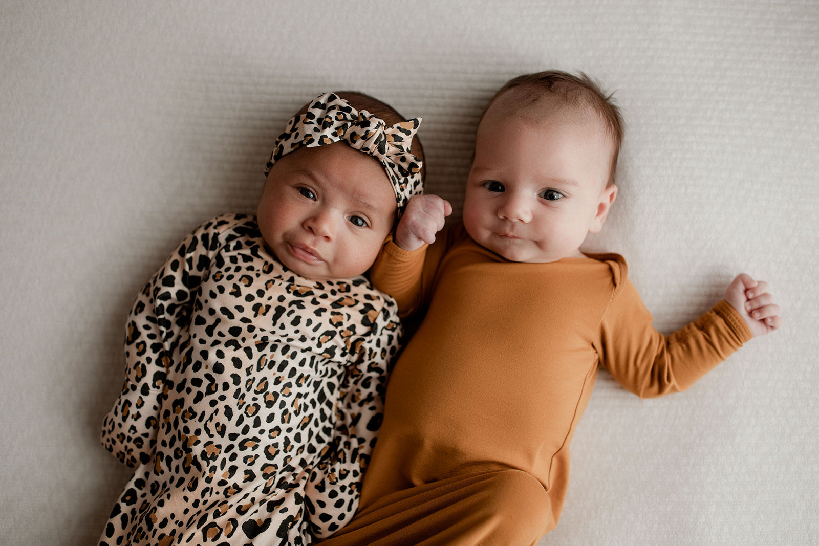 Twin Newborn Photoshoot with the Three Little Tots leopard print knotted gown.