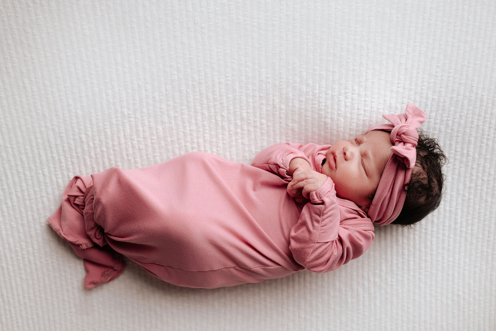 Luxuriously soft modal knotted baby gowns for newborn babies, offering comfort, easy diaper changes, and style. Three Little Tots Rose Pink Knotted baby gown 