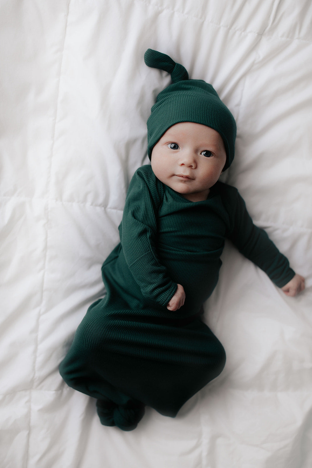 Ultra-soft newborn baby gowns with tie bottoms for easy nighttime changes and pull-down tabs for effortless dressing.