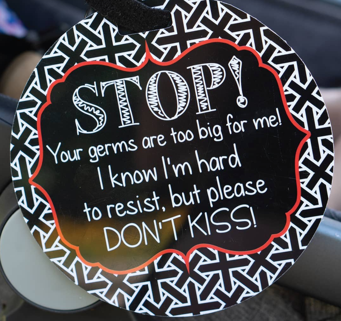 Three Little Tots Car Seat Sign on  a stroller