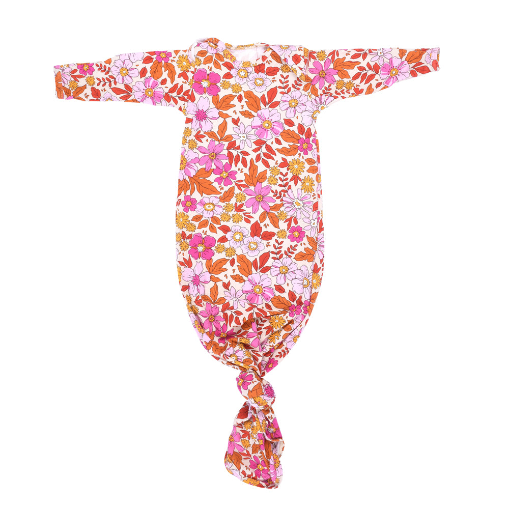 The cutest pink floral design for a newborn knotted baby gown. Trust in our knotted baby gowns, providing unparalleled comfort and ease for your baby's delicate skin.