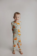 Toddler and big kid jammies in matching prints and solids, designed for comfy bedtime or lounging all day. Dinosaur themed Kids Pajamas.