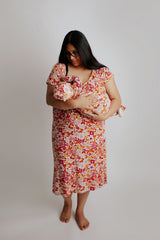 breastfeeding in the mommy and me matching Three little Tots labor gown and newborn baby gown