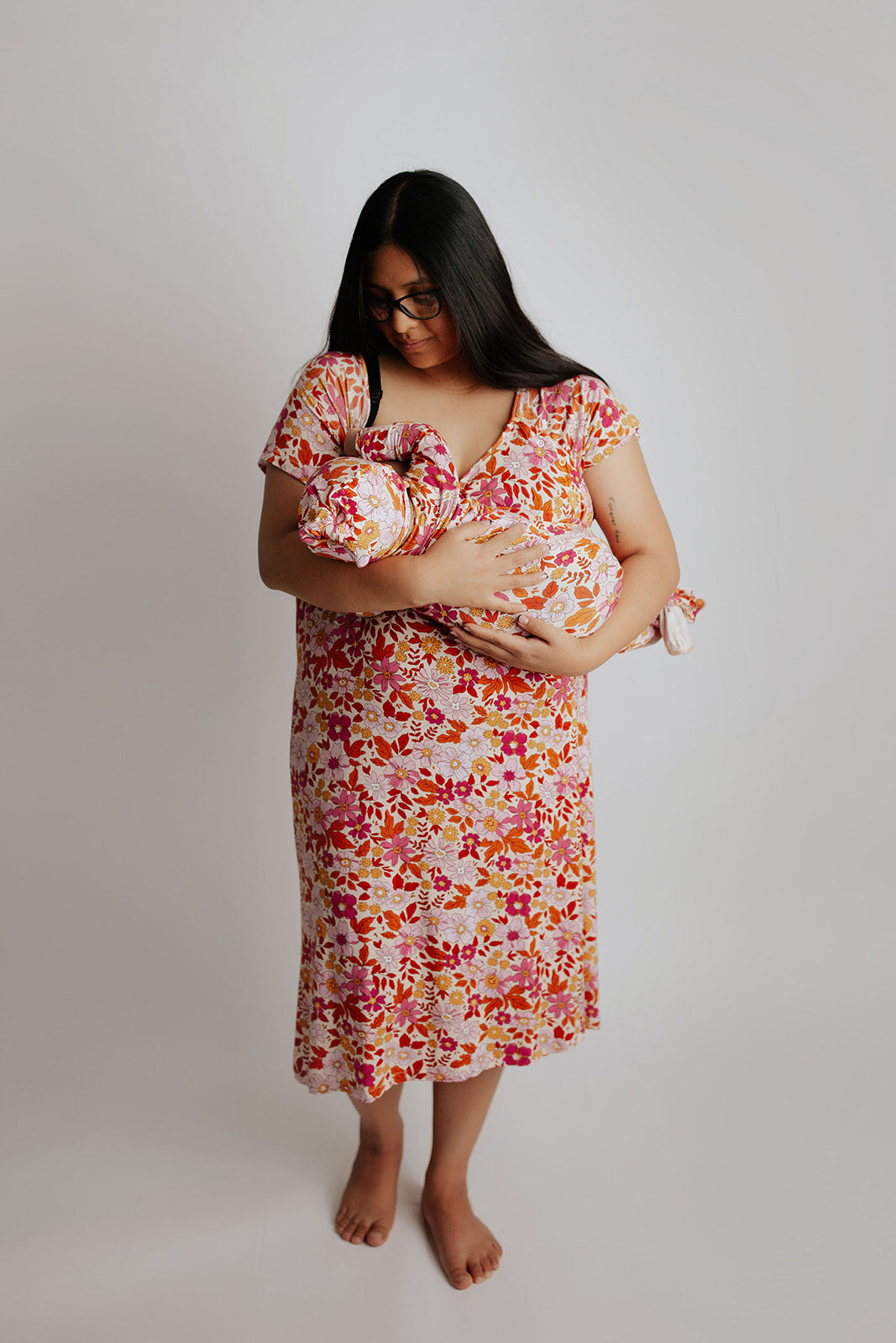 breastfeeding in the mommy and me matching Three little Tots labor gown and newborn baby gown
