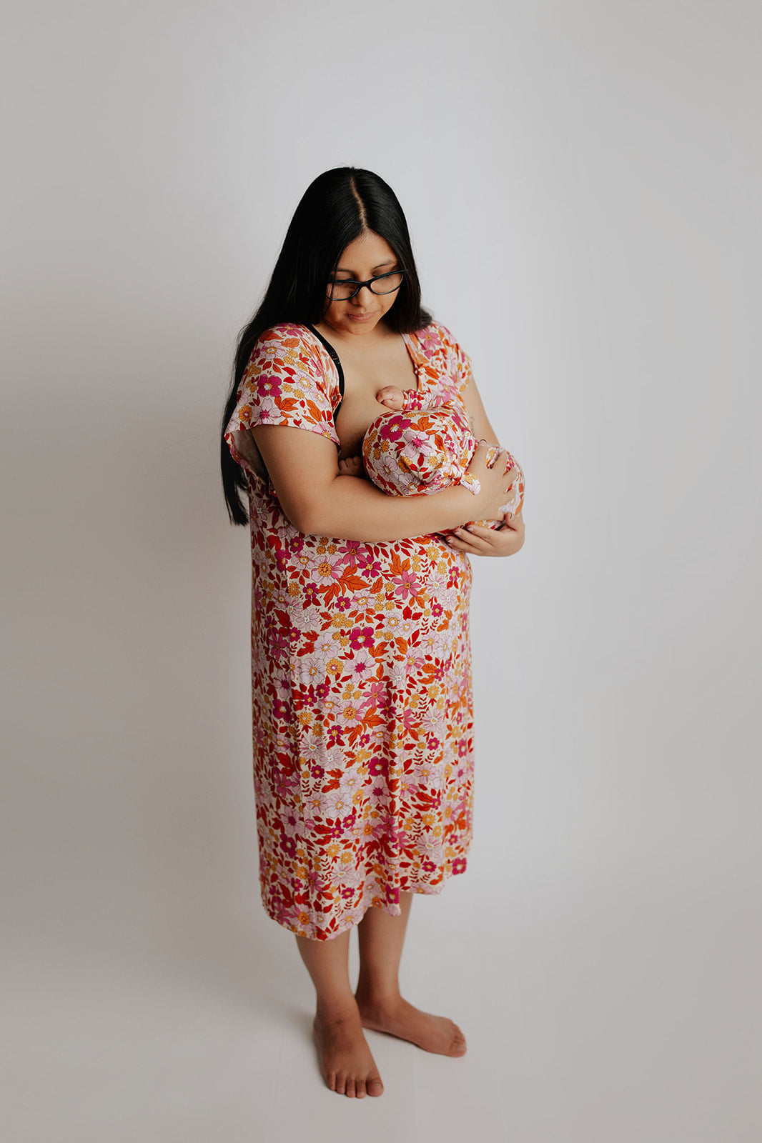 breastfeeding in the mommy and me matching Three little Tots labor gown and newborn baby gown