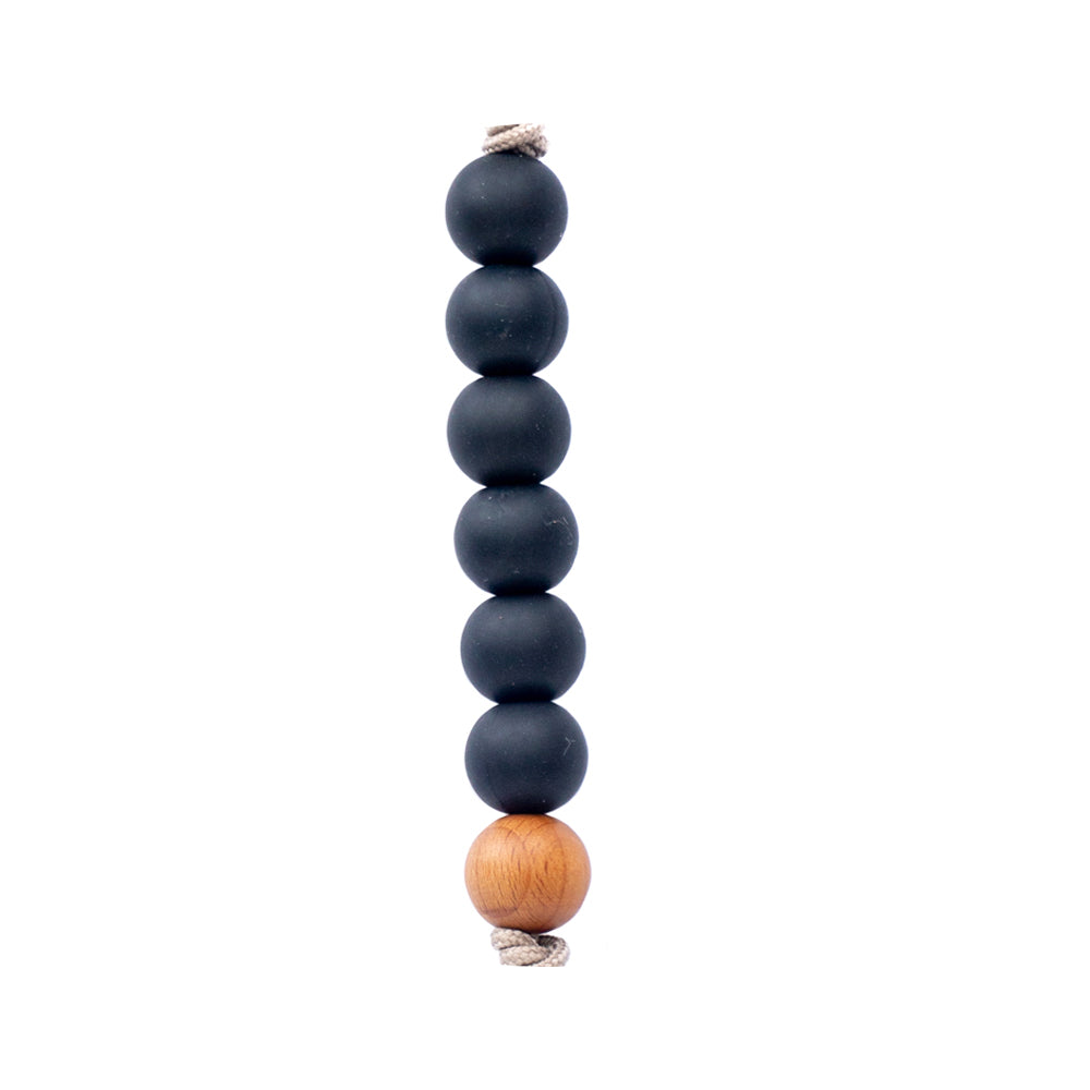 Keep your baby's pacifier secure and stylish with the Three Little Tots Black Silicone Beaded Pacifier Clip Holder.