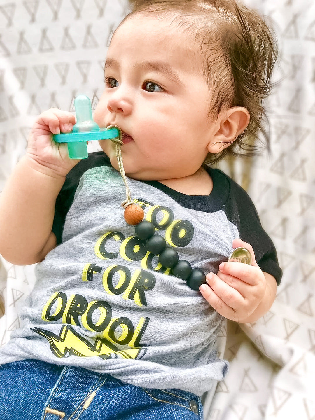Keep your baby's pacifier secure and stylish with the Three Little Tots Black Silicone Beaded Pacifier Clip Holder.