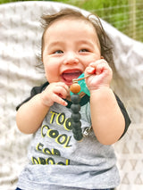 Keep your baby's pacifier secure and stylish with the Three Little Tots Black Silicone Beaded Pacifier Clip Holder.