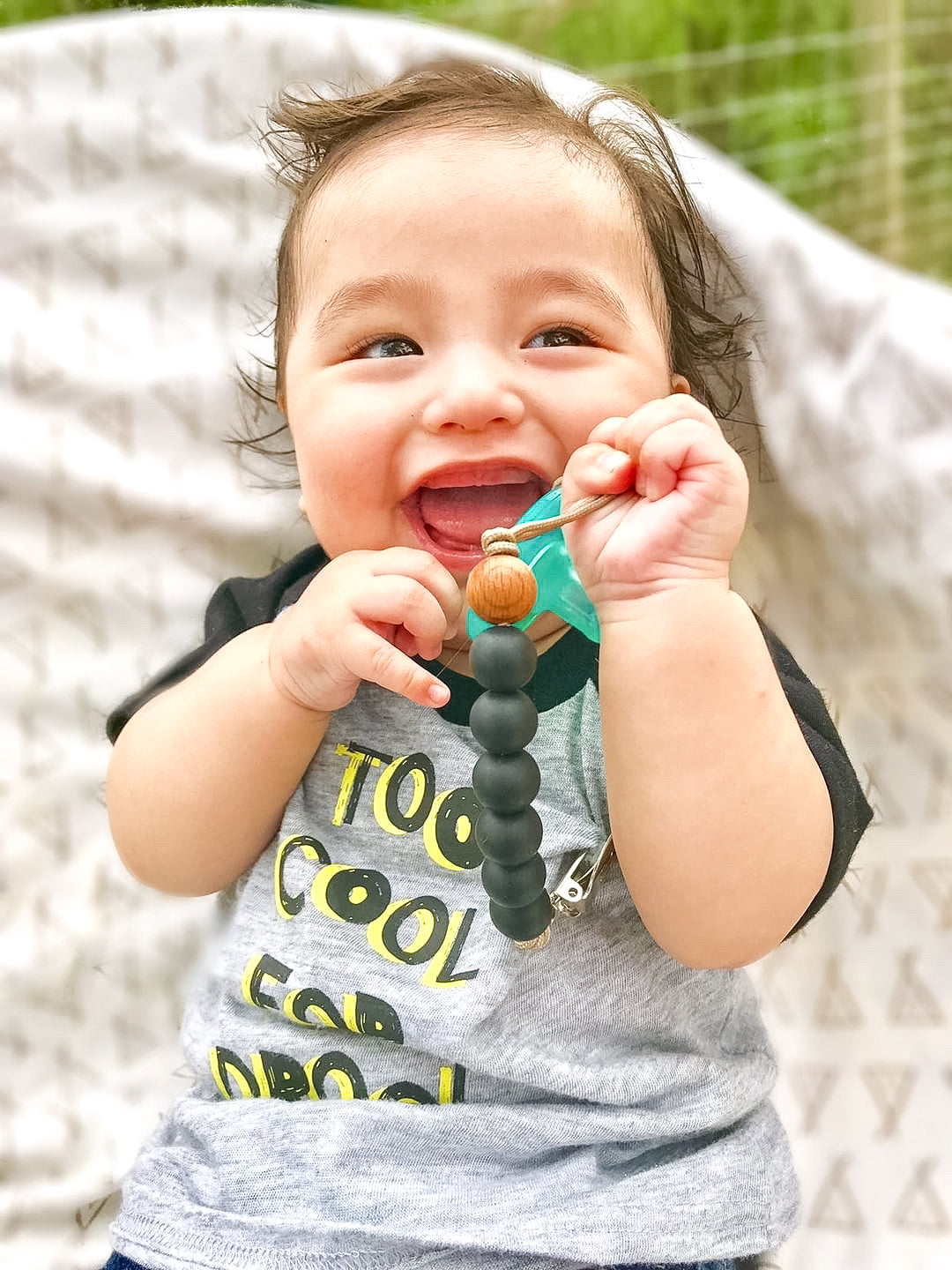 Keep your baby's pacifier secure and stylish with the Three Little Tots Black Silicone Beaded Pacifier Clip Holder.