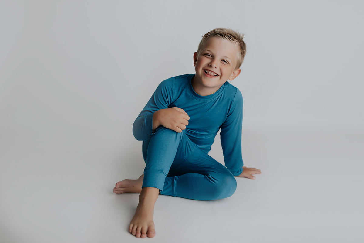 Toddler and big kid jammies in matching prints and solids, designed for comfy bedtime or lounging all day.