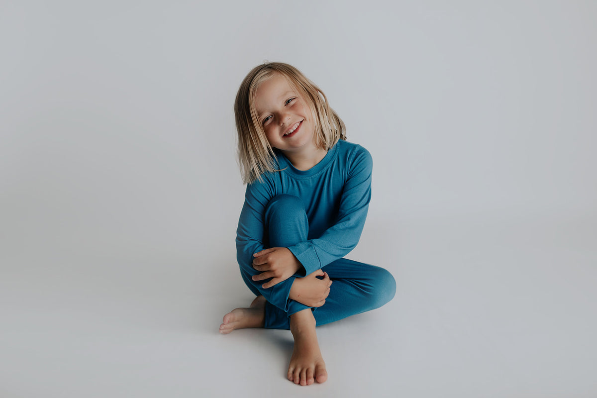 Toddler and big kid jammies in matching prints and solids, designed for comfy bedtime or lounging all day.
