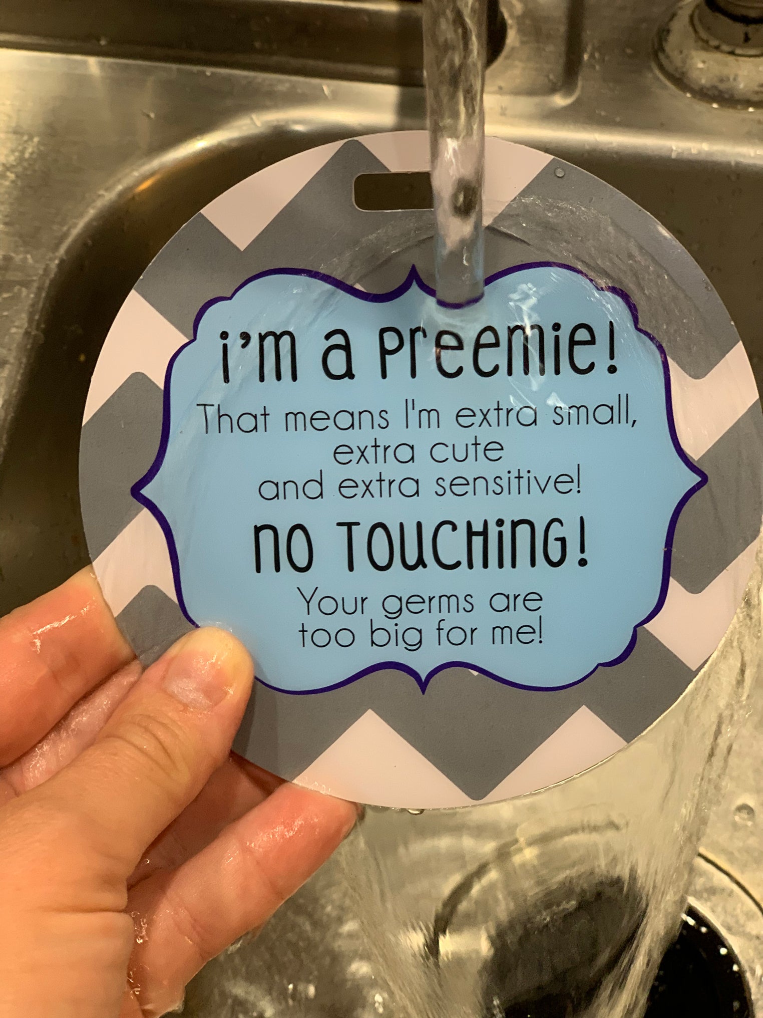 Three Little Tots no touching car Seat sign is waterproof.