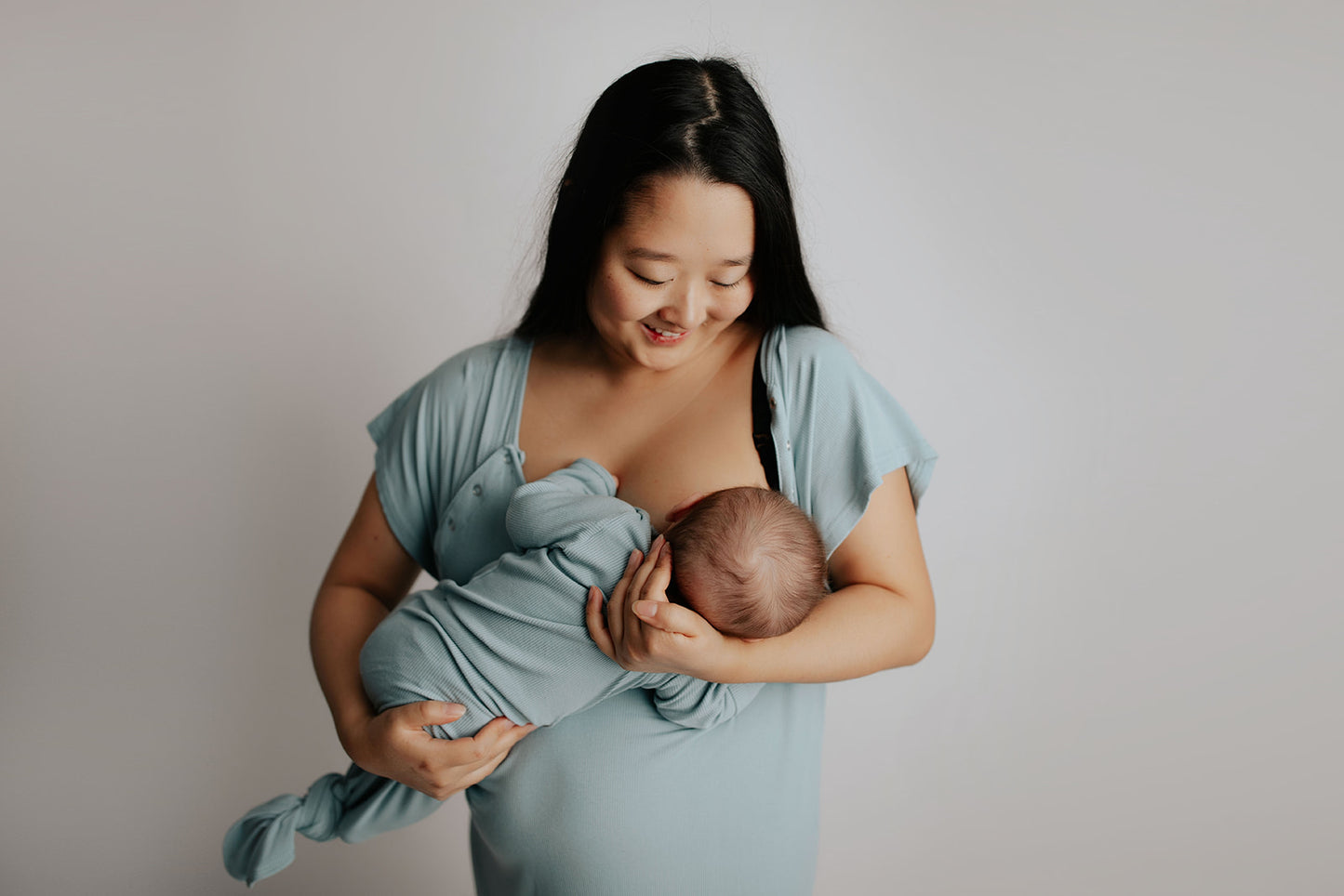 Breastfeeding made easy using the Three Little Tots Labor and delivery gown perfect for postpartum breastfeeding 