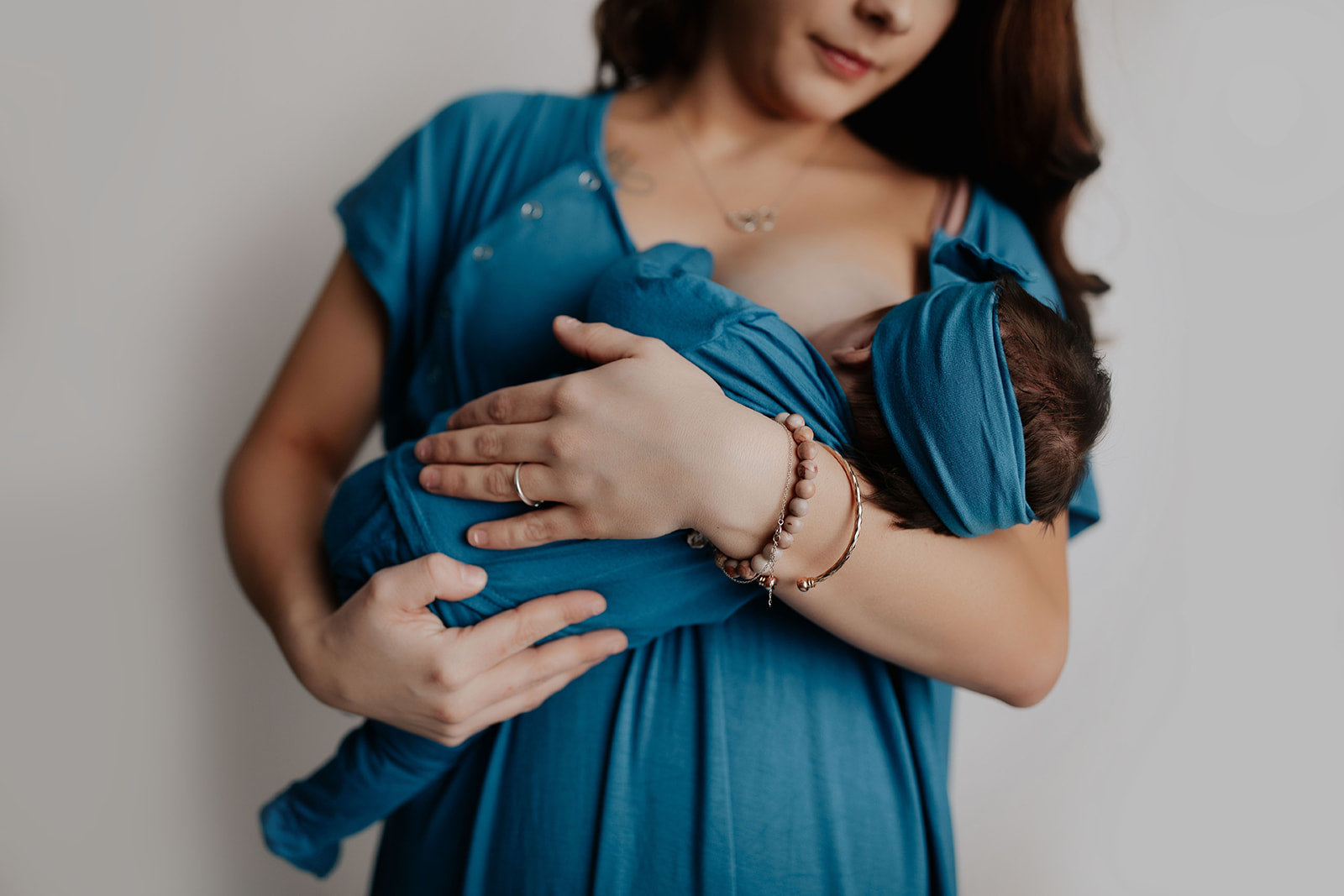 Match your newborn while you breastfeed them with the Three Little Tots blue mommy gown and matching pajamas,