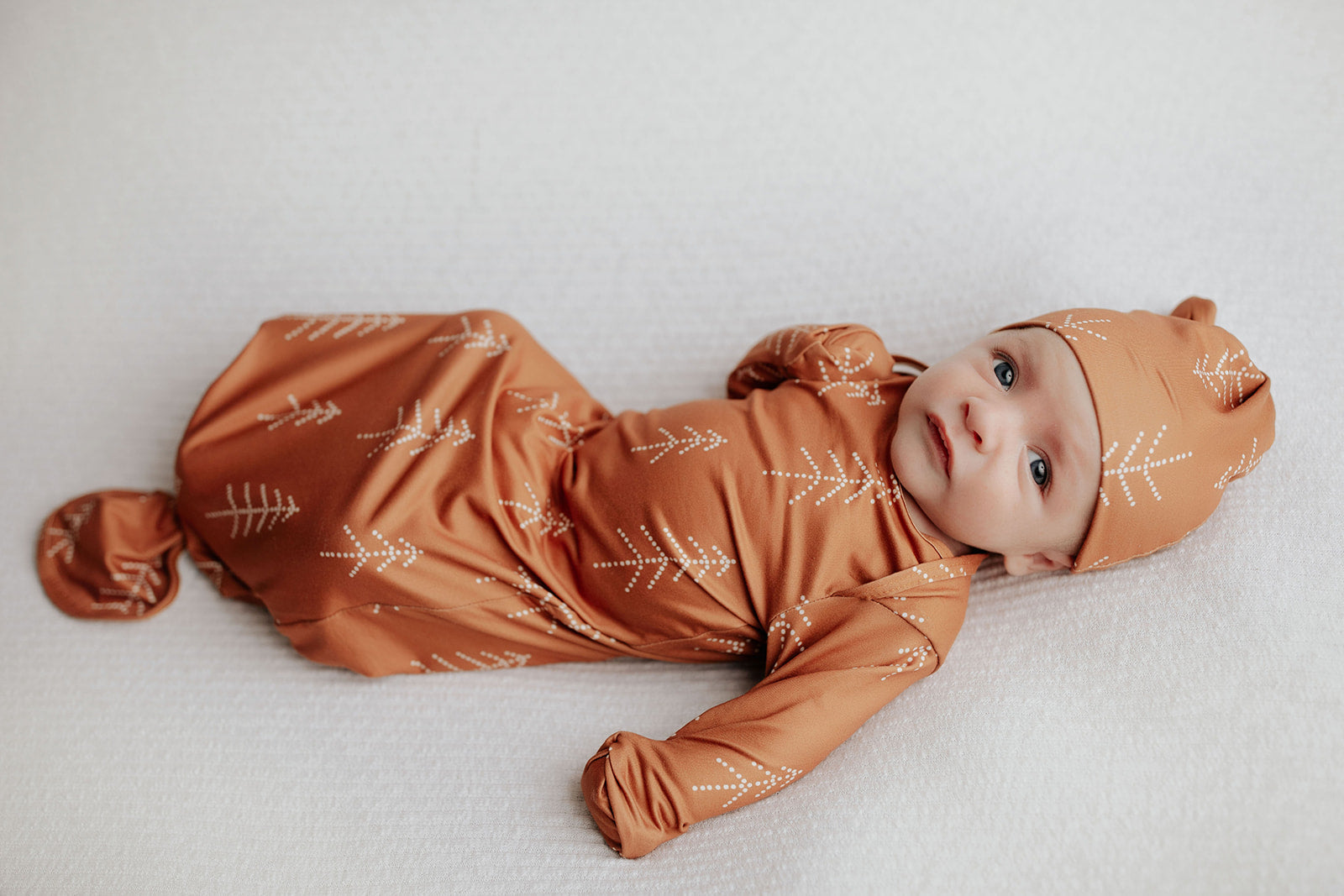Super soft Christmas-themed baby gowns with stretchy fabric and easy-access tie bottom for quick diaper changes.