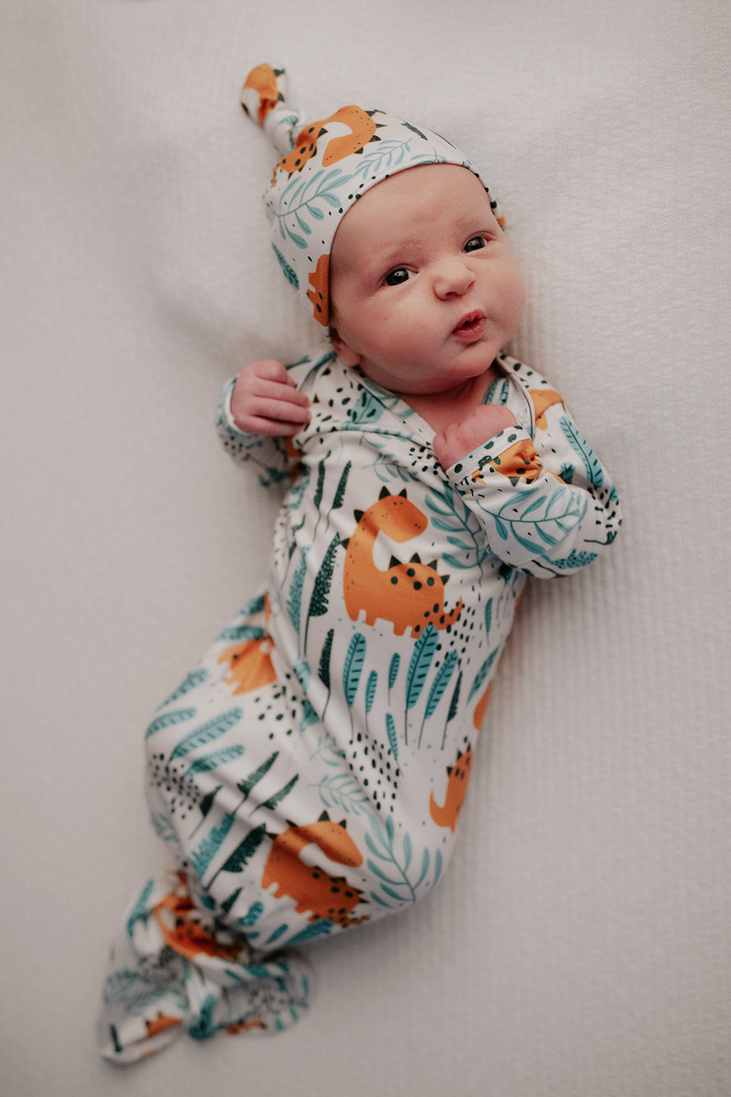 Ultra-soft Dinosaur baby gowns with stretchy fabric and tie bottom for easy night-time diaper changes.