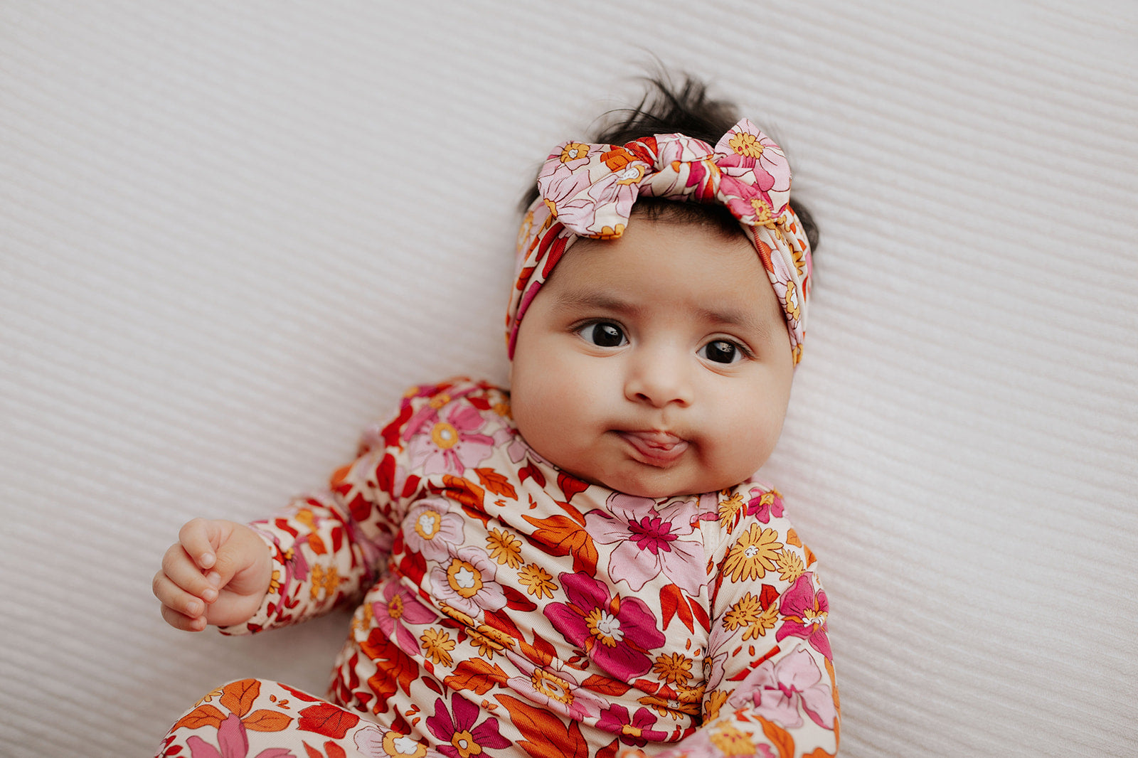 The cutest pink floral design for a newborn knotted baby gown. Trust in our knotted baby gowns, providing unparalleled comfort and ease for your baby's delicate skin.