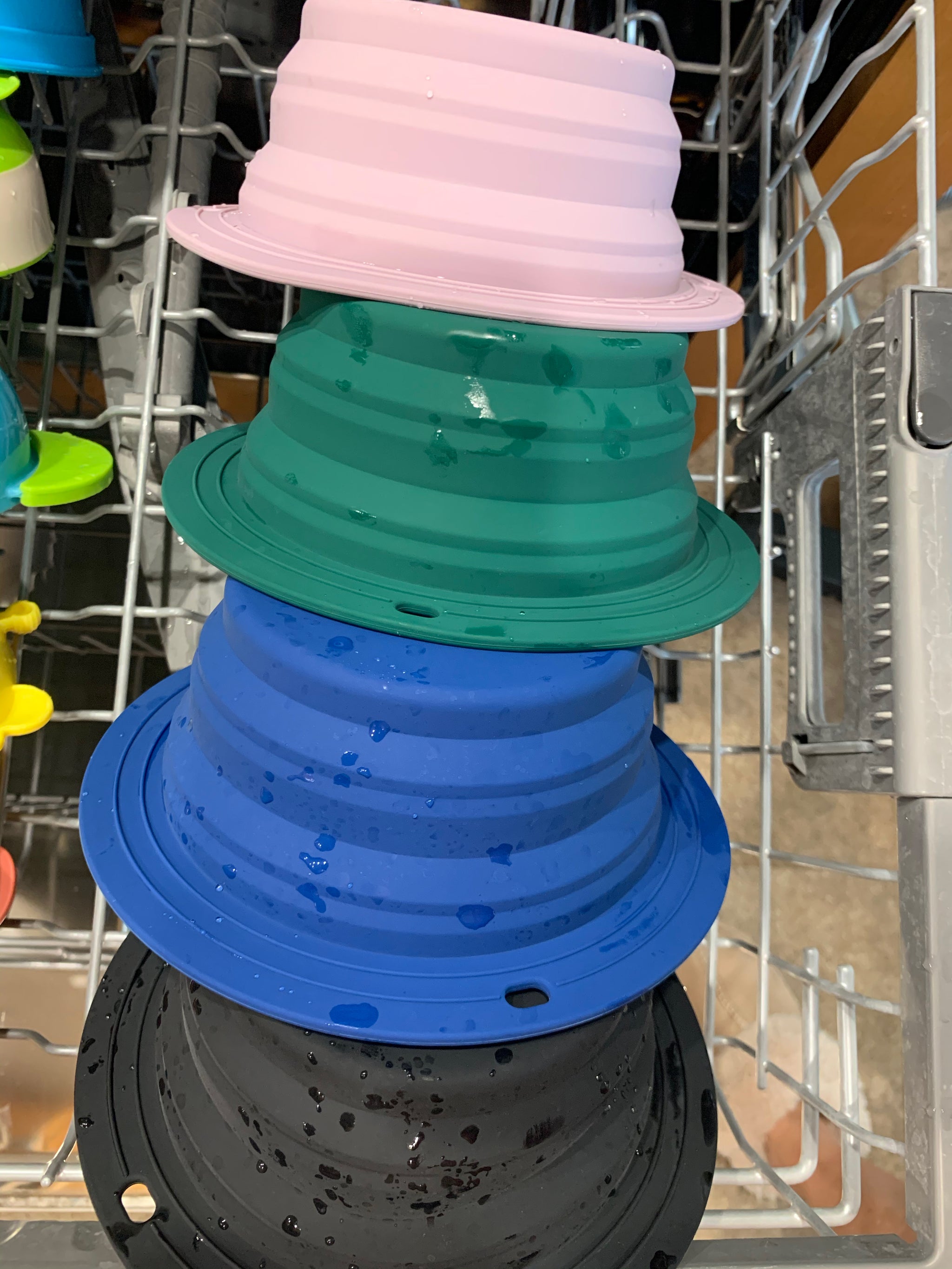 Travel-friendly silicone bowls with double grips, making snack time and cleanup a breeze for moms.