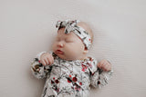 Comfort-focused baby gowns with soft, stretchy material and convenient pull-down tabs for quick dressing and changes.