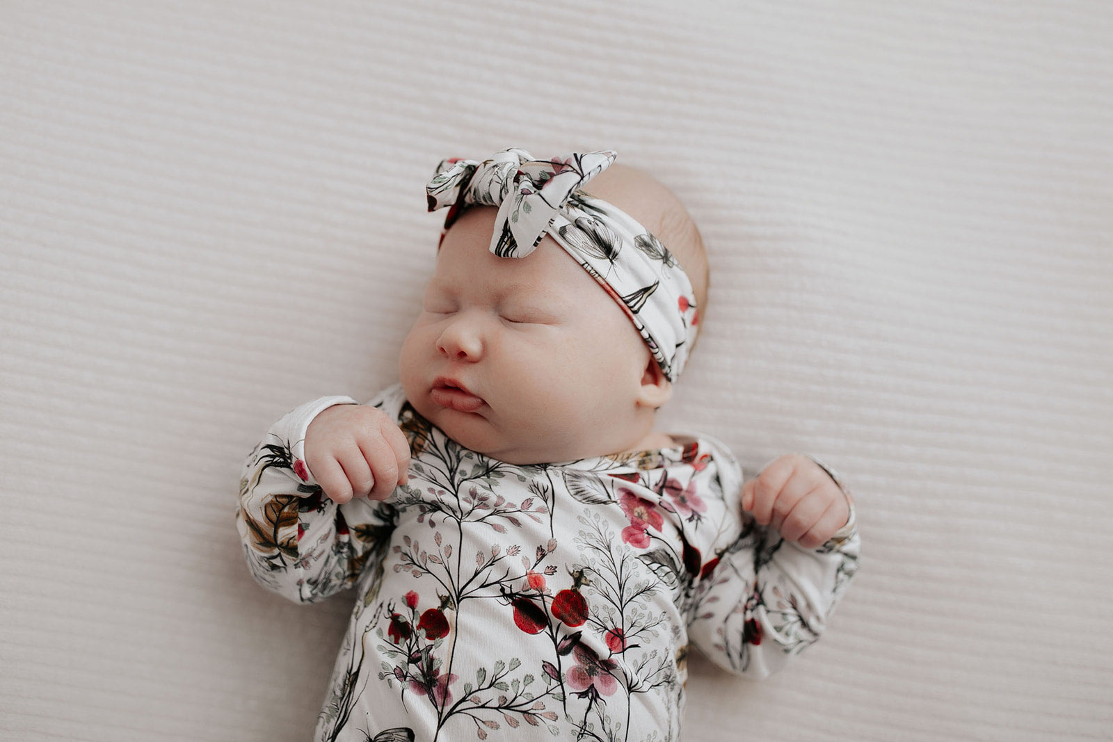 Comfort-focused baby gowns with soft, stretchy material and convenient pull-down tabs for quick dressing and changes.