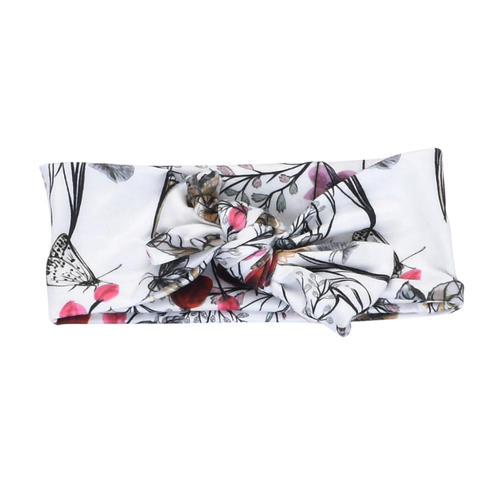 Hand-tied knotted headbands, buttery soft and stretchy, perfect for your little girl's comfort and style.