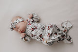 Comfort-focused baby gowns with soft, stretchy material and convenient pull-down tabs for quick dressing and changes.