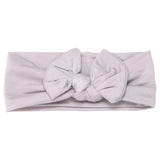 Hand-tied and made with love. Our popular buttery soft and stretchy knotted headbands are perfect for your little girl!