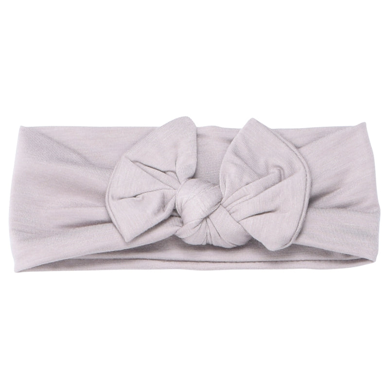 Hand-tied and made with love. Our popular buttery soft and stretchy knotted headbands are perfect for your little girl!
