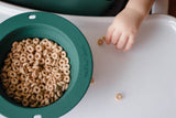 Travel-friendly silicone bowls with double grips, making snack time and cleanup a breeze for moms.