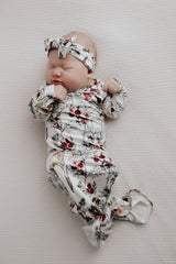 Comfort-focused baby gowns with soft, stretchy material and convenient pull-down tabs for quick dressing and changes.