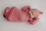 Luxuriously soft modal knotted baby gowns for newborn babies, offering comfort, easy diaper changes, and style. Three Little Tots Rose Pink Knotted baby gown. Knotted tie bottom mimics the womb to bring comfort to your newborn