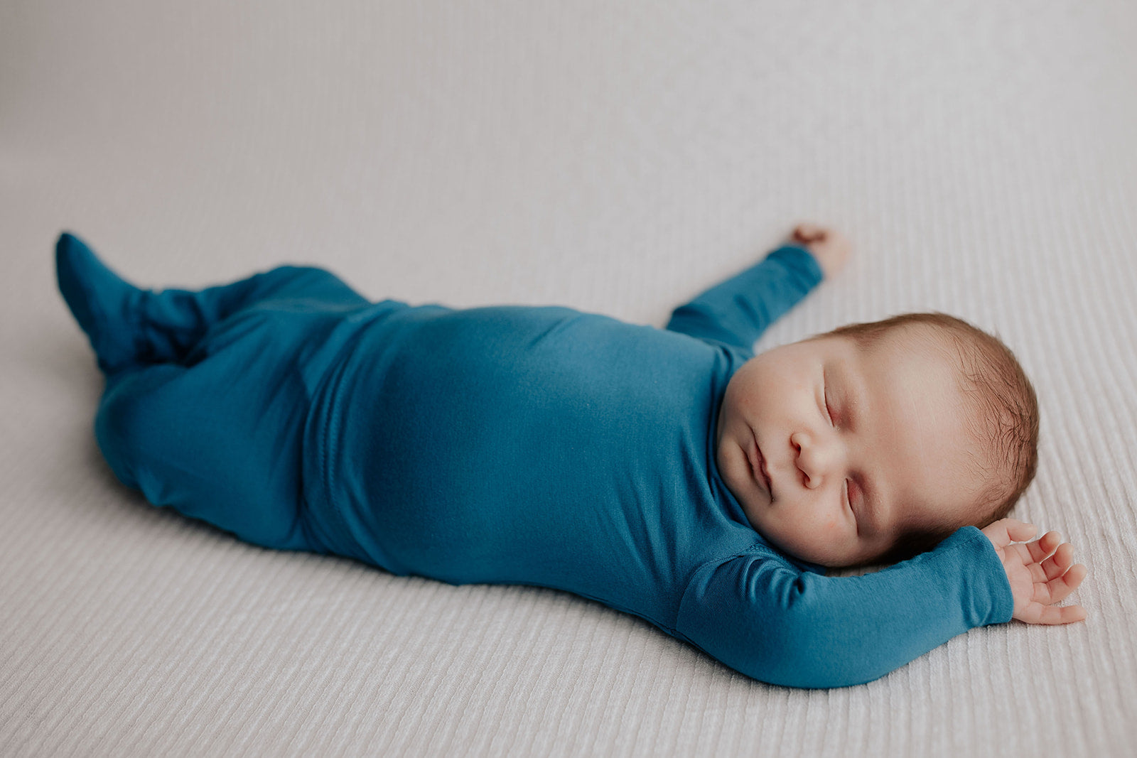 Newborn Jammies with buttery-soft fabric, fold-over mittens, footies for ultimate comfort and all-day coziness.